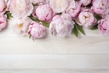 Peonies on a white wooden background