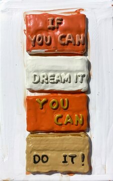 A compelling visual representation of the quote "If you can dream it, you can do it." This includes an individual standing on top of a mountain, overlooking a landscape bathed in the golden light 