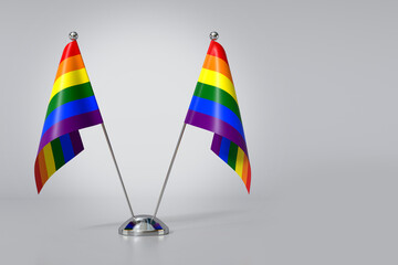 Double Gay Pride Table Flag on Gray Background. 3d Rendering