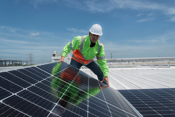 Engineers walking on roof inspect and check solar cell panel by hold equipment box and radio...