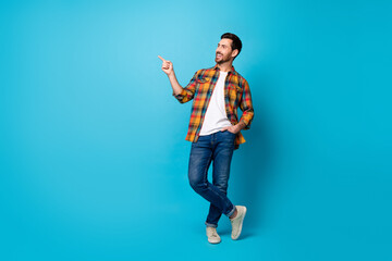 Full length photo of cool guy wear checkered shirt denim pants directing look at discount empty...