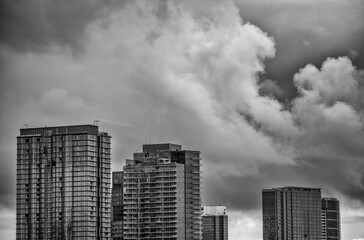 Close Together Skyscrapers Under Overcast Sky in Black and White.