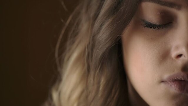 beautiful fresh young woman half face portrait: pensive, worried woman