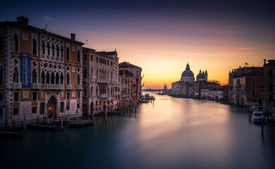 A River Running Through a City Next to Tall Buildings in Venice