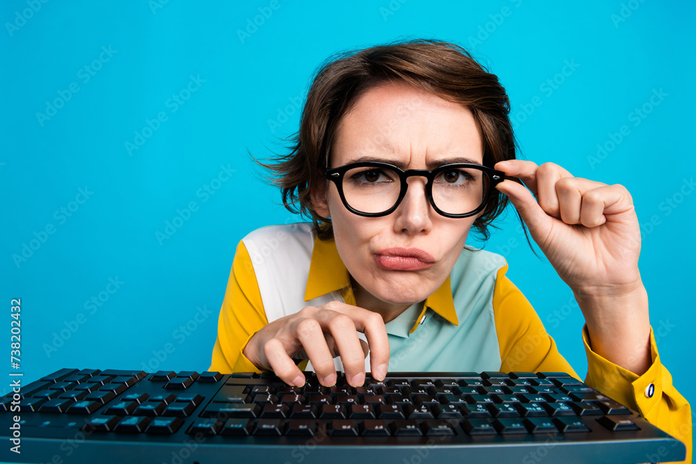 Poster photo of manager girl working pc computer hesitate writing programming code isolated blue color back