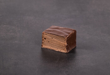 Chocolate souffle in chocolate. In the section. Dark gray background. Close-up