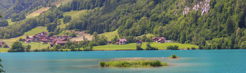 Lovely emerald green lake Lungerersee in Swiss Alps, canton of Obwalden, Switzerland