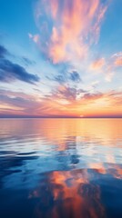 Naklejka premium A vivid sunset over a calm sea