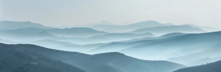 Schilderijen op glas Hills and mountains in fog. Horizontal landscape photography. Panoramic aerial view. Image for banner, blog, advertisement. © Dennis