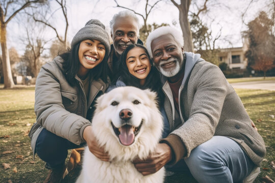 Multi generational family with happy dog.
