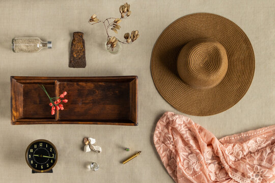 flat lay view of womens belongings that are aged and feminine