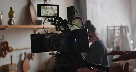 The cameraman with a professional movie camera at work.