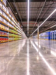 Picture a central aisle of a food warehouse where the cleanliness of the polished concrete floor reflects the high standards