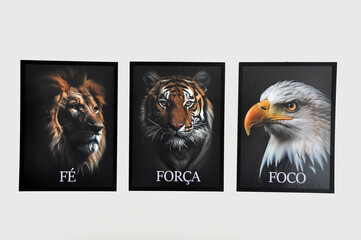 quadros de leão, tigre e águia, representando fé, força e foco 