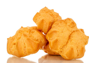 Three delicious eclairs, macro, isolated on white background.