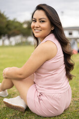 lifestyle of young girl wearing pink casual dress with long hair, beauty and fashion, portrait of happy and natural person