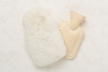Rubber water warmer bag on concrete background, top view