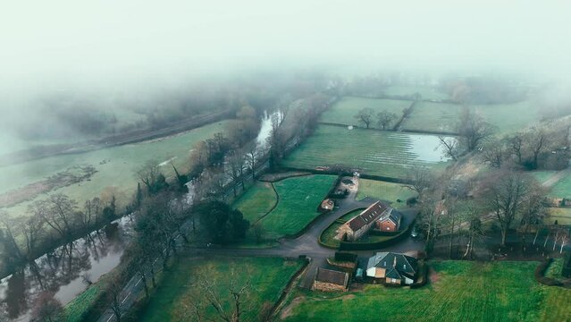Ruswarp is a pretty village that lies in the scenic Esk Valley, just one mile south of Whitby. Misty Yorkshire landscape scene. Coastal winter setting