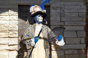 Venice, Italy - February 2024 - carnival masks are photographed with tourists in San Marco square