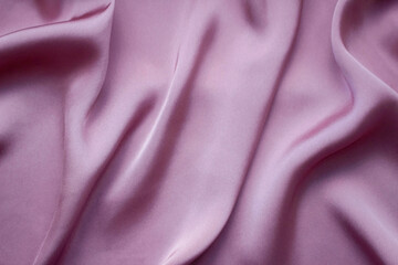 Fototapeta premium Pink silk or satin background. Elegant, delicate and beautiful texture. 