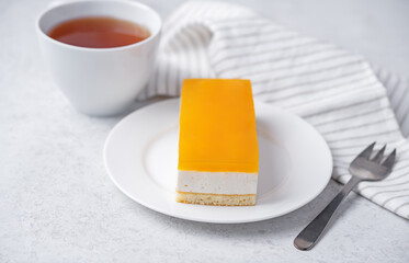 Mango and mousse cream cake in a plate
