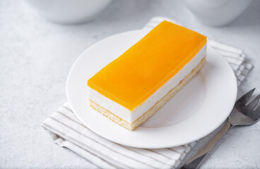 Mango and mousse cream cake in a plate