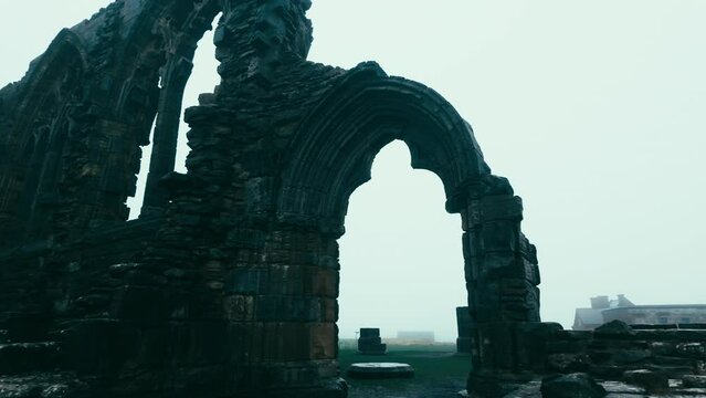 Foggy winters scene of the famous landmark Whitby Abby now derelict and formally a Benedictine abbey and is situated overlooking the sea on the East coast of England