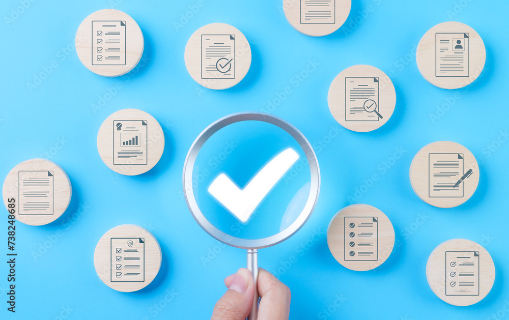 Poster quality assurance document control concept. magnifying glass focus on checkmark for document approve