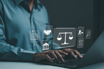 Businessman or Lawyer working with legal services icons on a laptop virtual screen can legal advice online such as labor law for business or company. Notary public, business legislation, justice, - obrazy, fototapety, plakaty