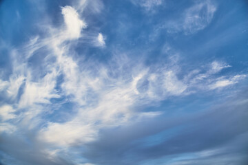  White feathery clouds on a blue sky