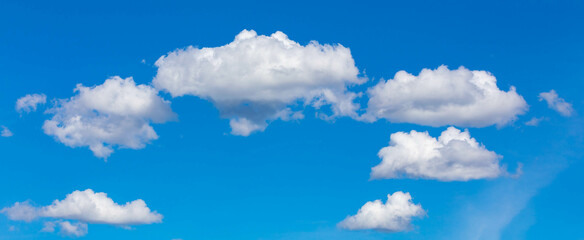Typical blue sky with scattered white clouds