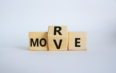 More Move symbol. Wooden cubes with words More Move. Beautiful white background. Business concept and More Move. Copy space