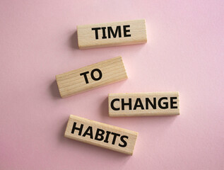 Time to Change Habits symbol. Wooden blocks with words Time to Change Habits. Beautiful pink...