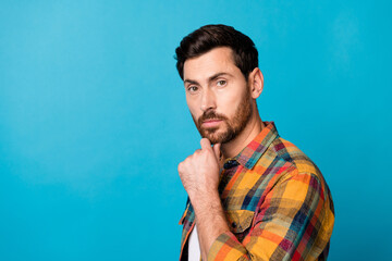Portrait of intelligent smart guy with stubble wear checkered shirt hold arm on chin near empty...