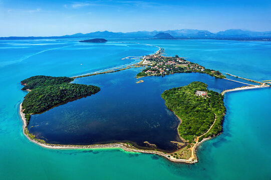 This is not some kind of atoll in the Indian or the Pacific Ocean. It is Koronissia island in the Ambracian ("Amvrakikos") gulf, Arta, Epirus, Greece.