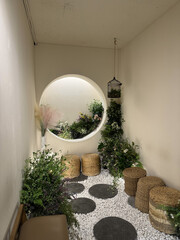 A relaxing room filled with plants, light and space — a fairy garden
