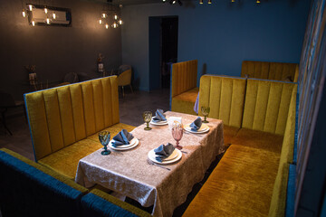 Elegant restaurant interior with yellow booths for fine dining and special events.