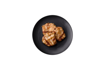 Round minced chicken or pork cutlet wrapped in bacon with salt, spices and herbs