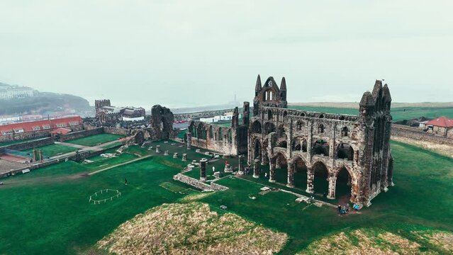Foggy winters scene of the famous landmark Whitby Abby now derelict and formally a Benedictine abbey and is situated overlooking the sea on the East coast of England
