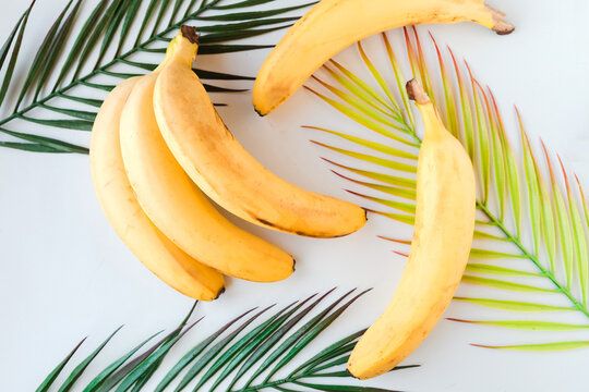 Fresh tasty yellow bananas on white background. Healthy food concept. Minimal concept