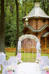 Wedding arch and chairs for guests at the wedding ceremony