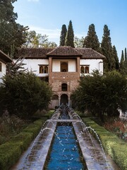 Fountain in the Patio de la Acequia in the Generalife gardens of the Alhambra palace in Granada,...
