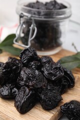 Tasty dried prunes on table, closeup view
