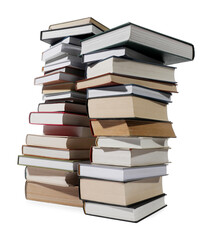 Fototapeta premium Stacks of many different books isolated on white