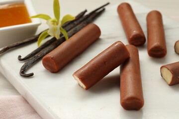 Glazed vanilla curd cheese bars served on table, closeup