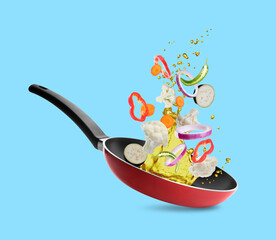 Different vegetables, oil, frying pan in air on light blue background