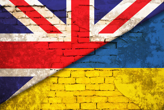 Flags of United Kingdom and Ukraine on brick wall. International diplomatic relationships
