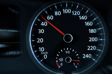 Speedometer on car dashboard, closeup. Motion blur effect