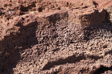 Red volcanic rock texture close up
