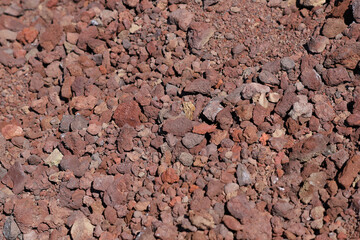 Red volcanic rock texture close up